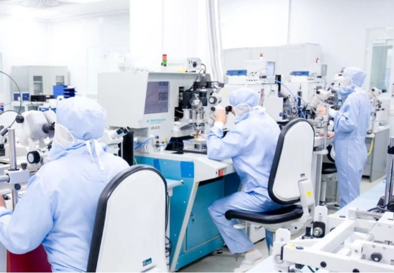 Chemical inspector checking chemical product indicators and sorting out professional inspection reports for trade compliance Chemical inspector checking chemical product indicators and sorting out professional inspection reports for trade compliance